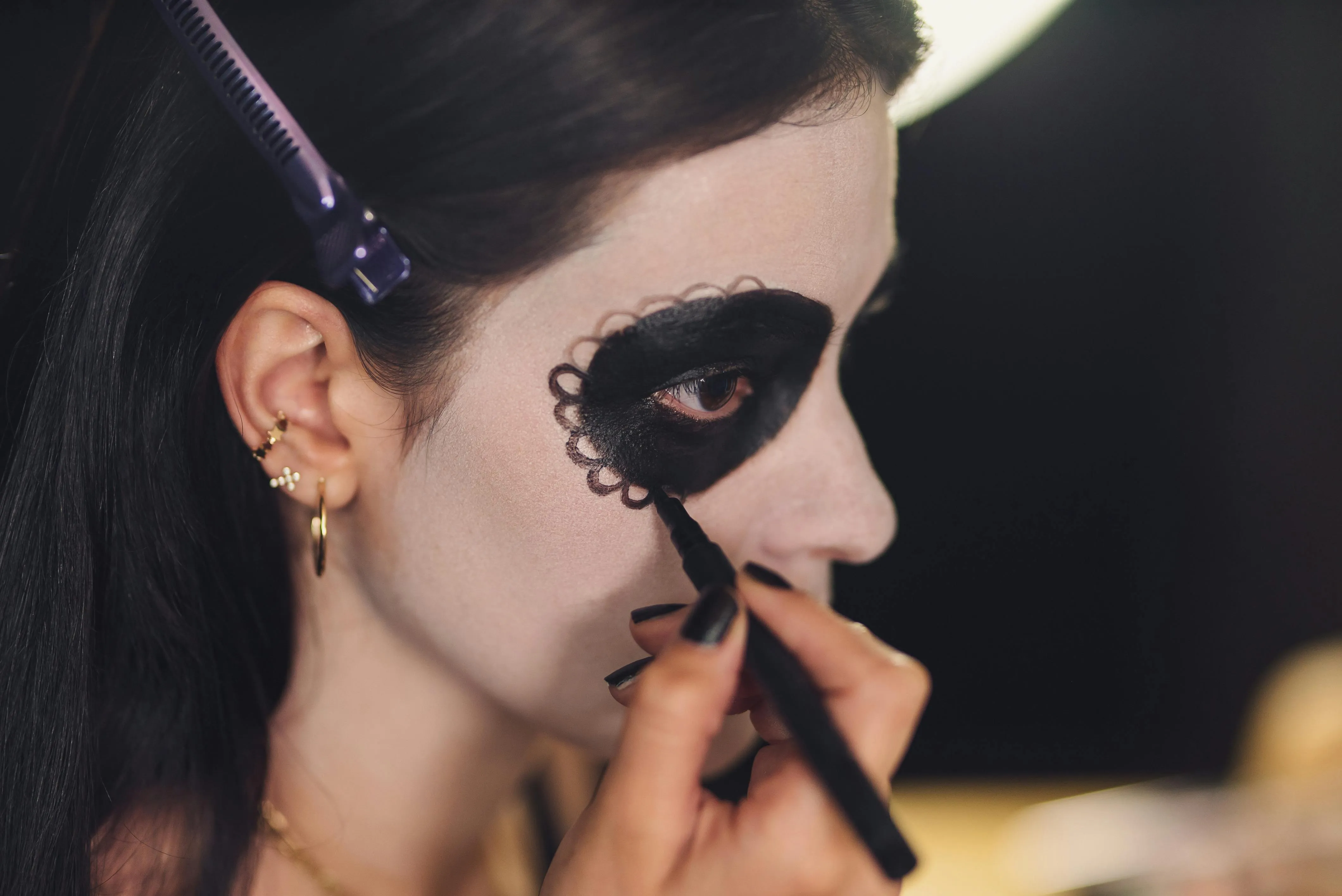 Makeup Artist Creating Day of the Dead Look for Halloween