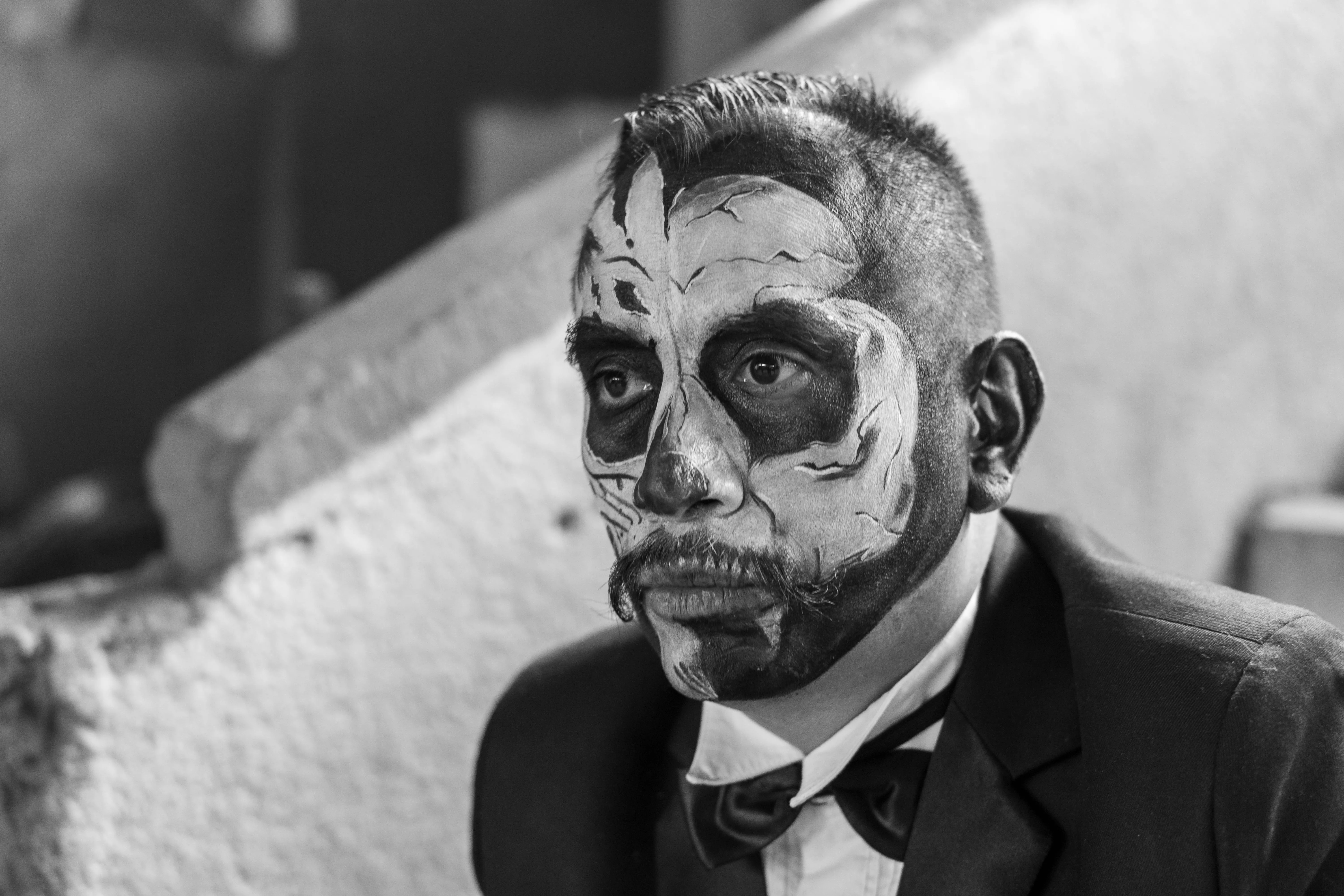 Man in Black Suit with Day of the Dead Face Makeup Wallpaper