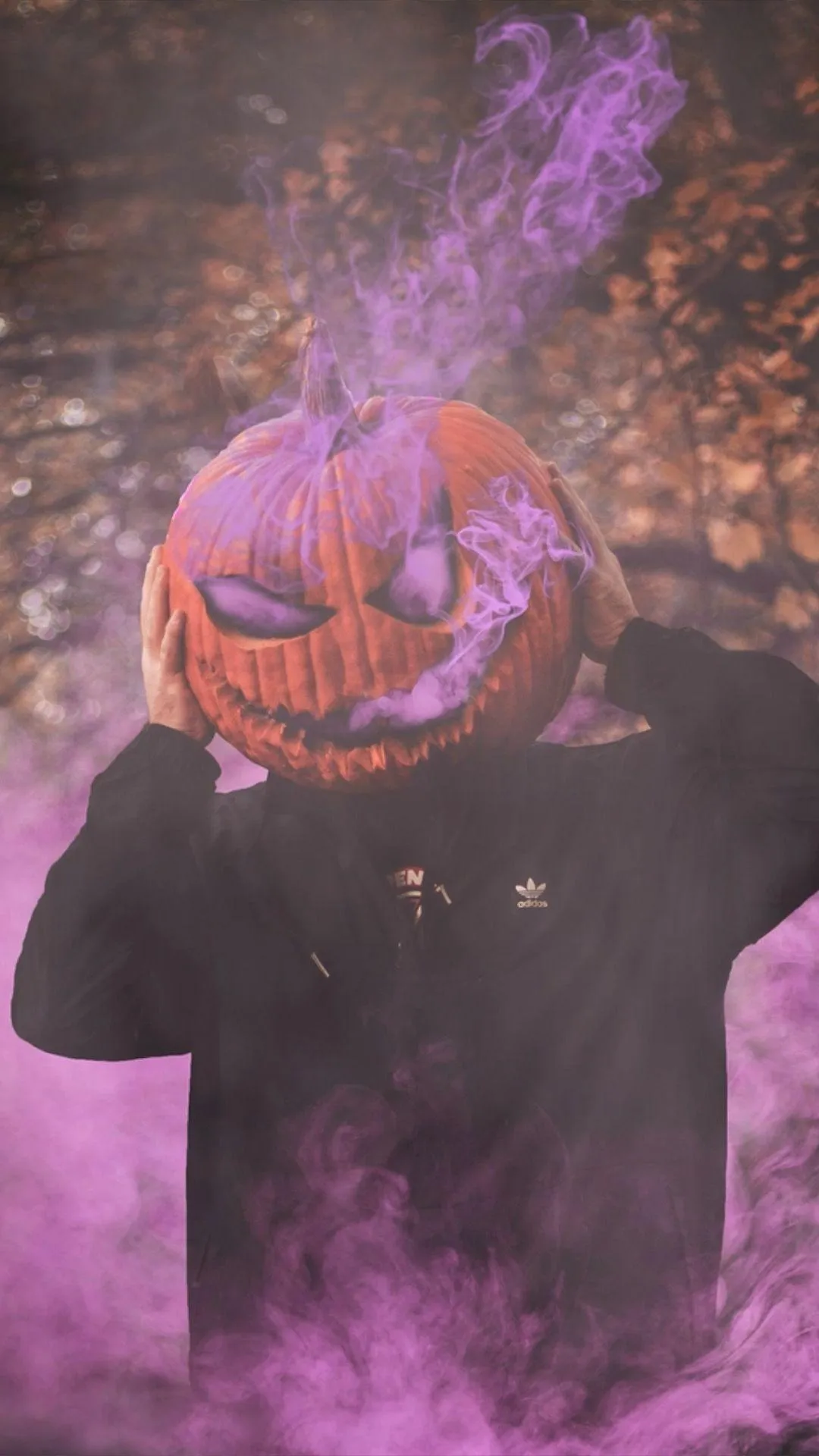 Man in Pumpkin Head Costume Surrounded by Purple Smoke HD