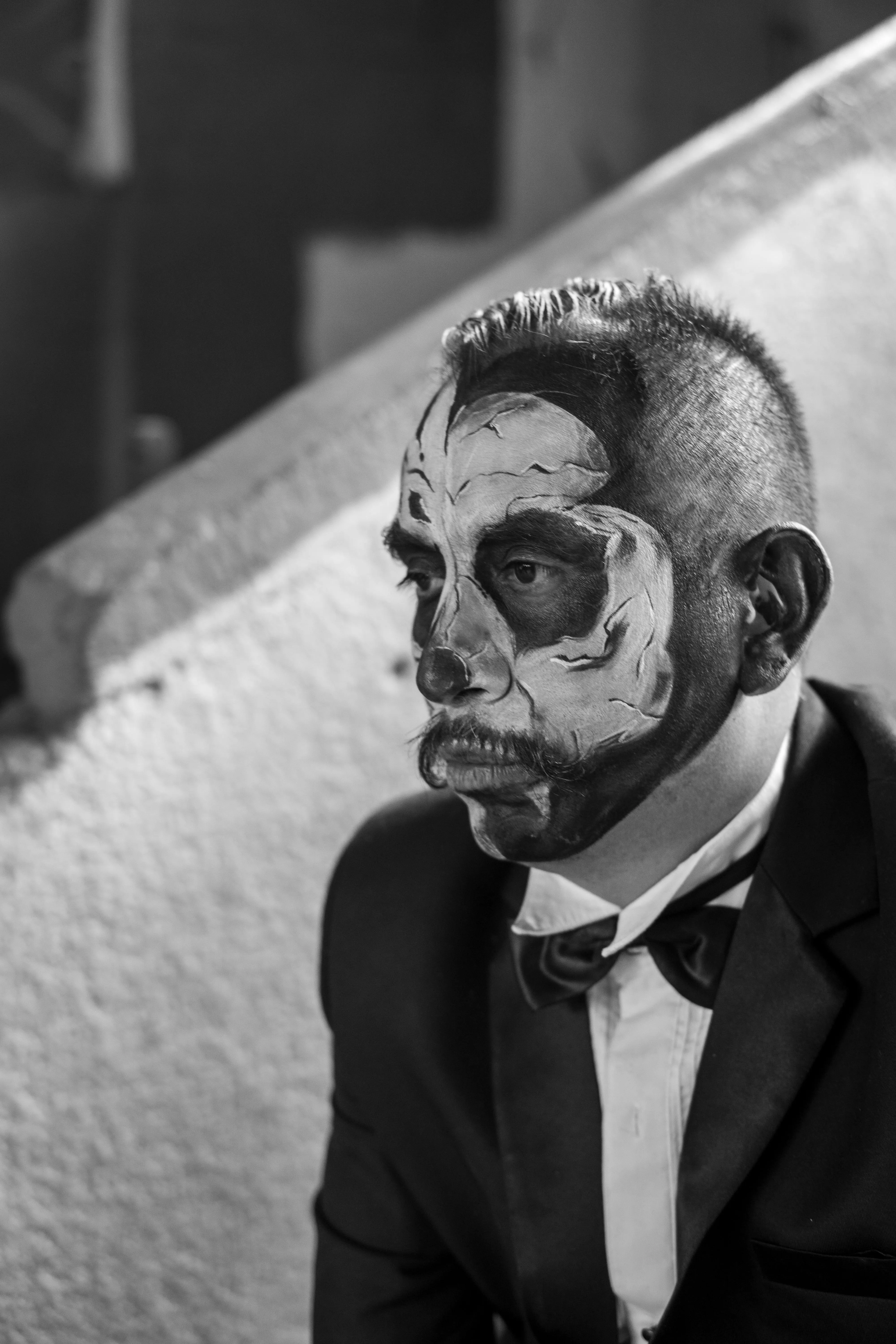 Man in Suit with Skull Makeup at Halloween Event HD image