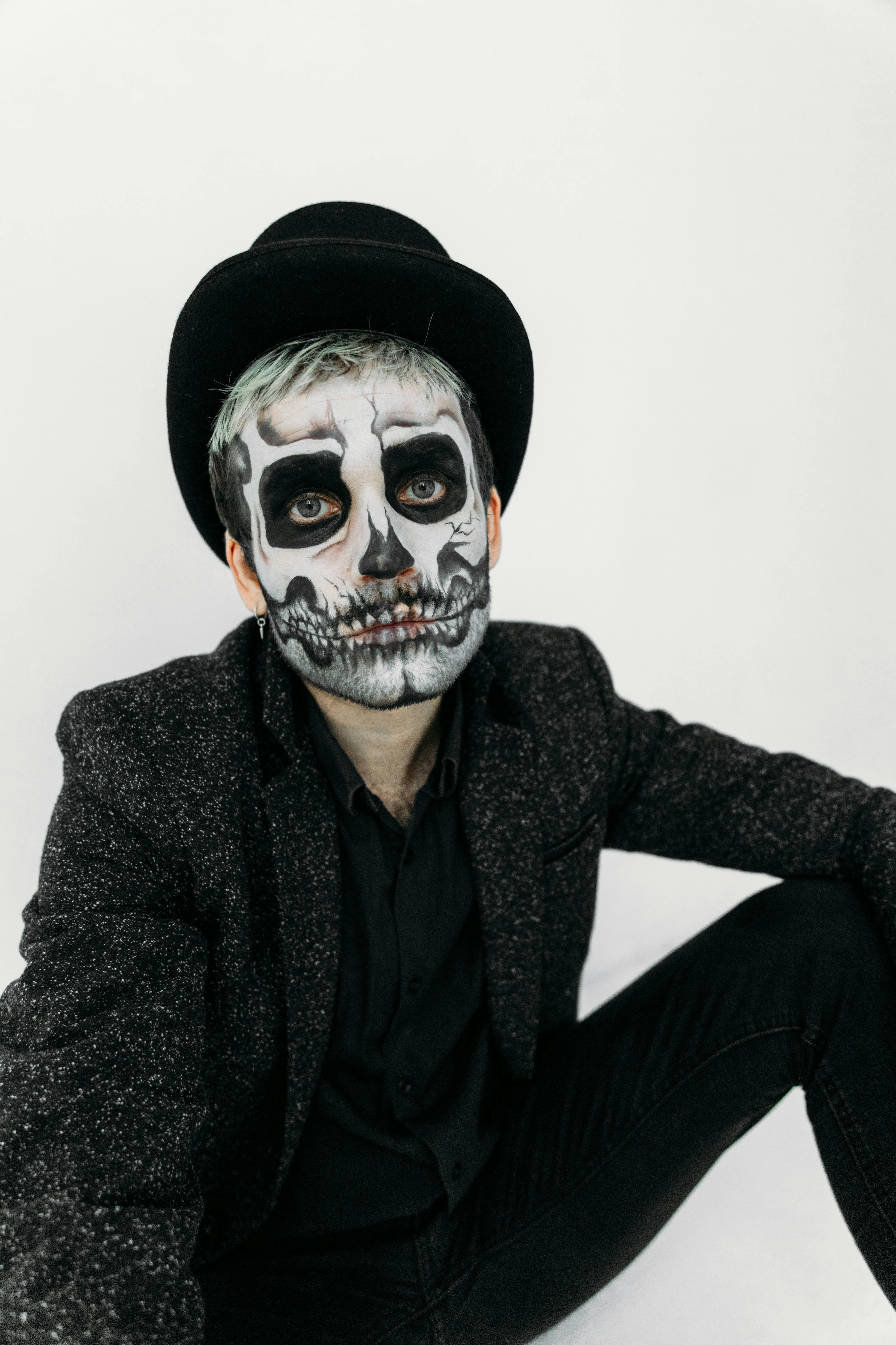 Man Wearing Skeleton Makeup and Black Hat Portrait