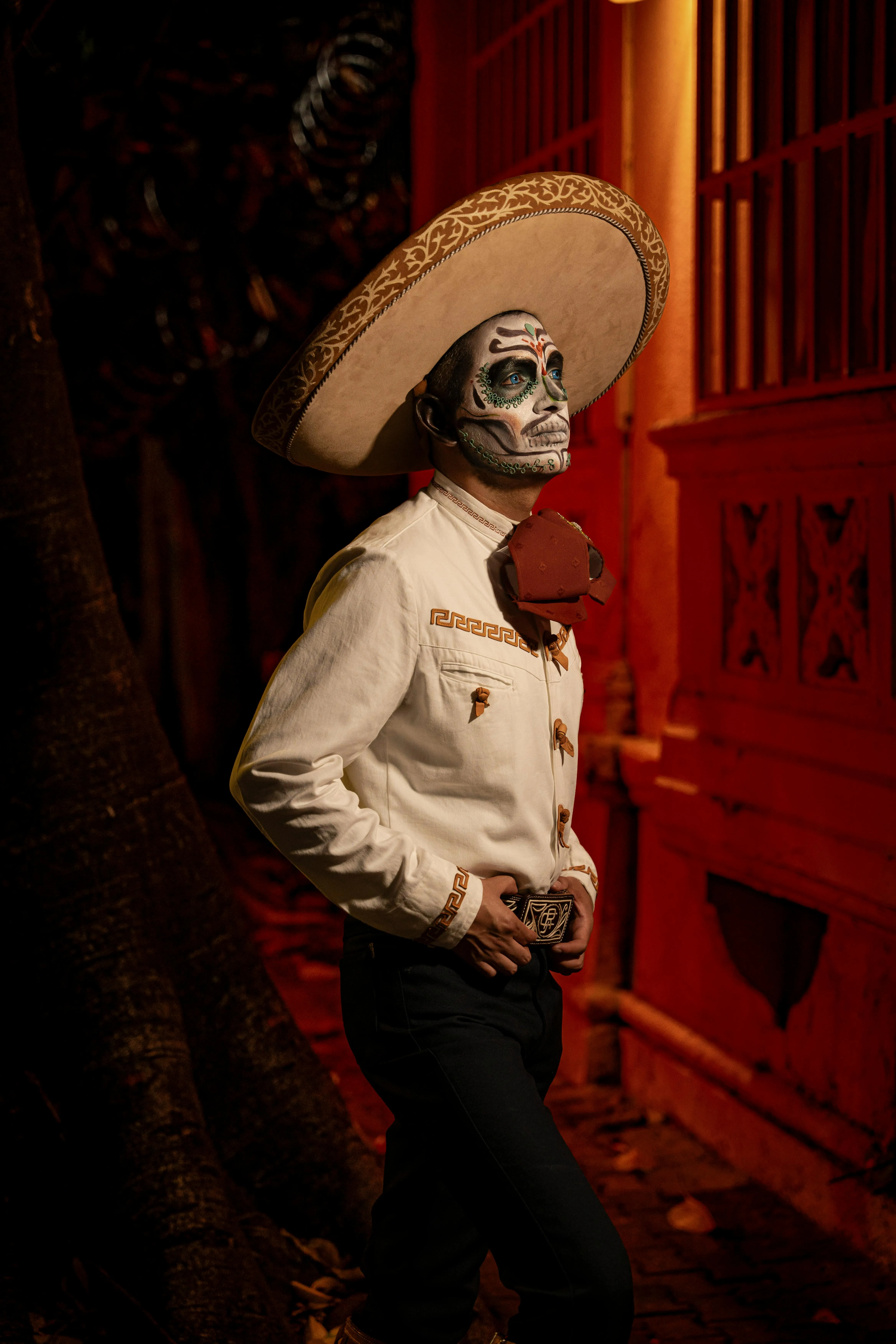 Man with Painted Face in White Suit on Halloween Night
