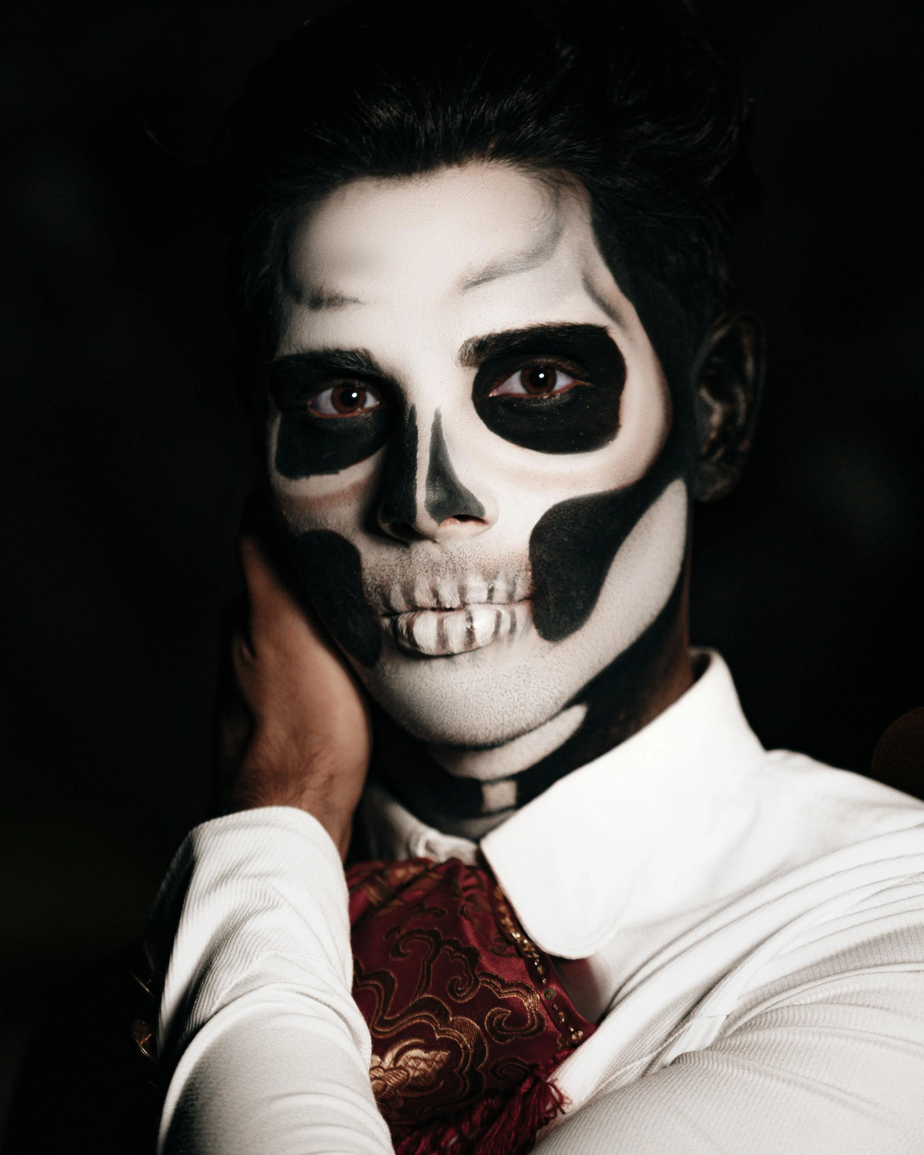 Man with Skeleton Face Paint Wearing Formal Attire image