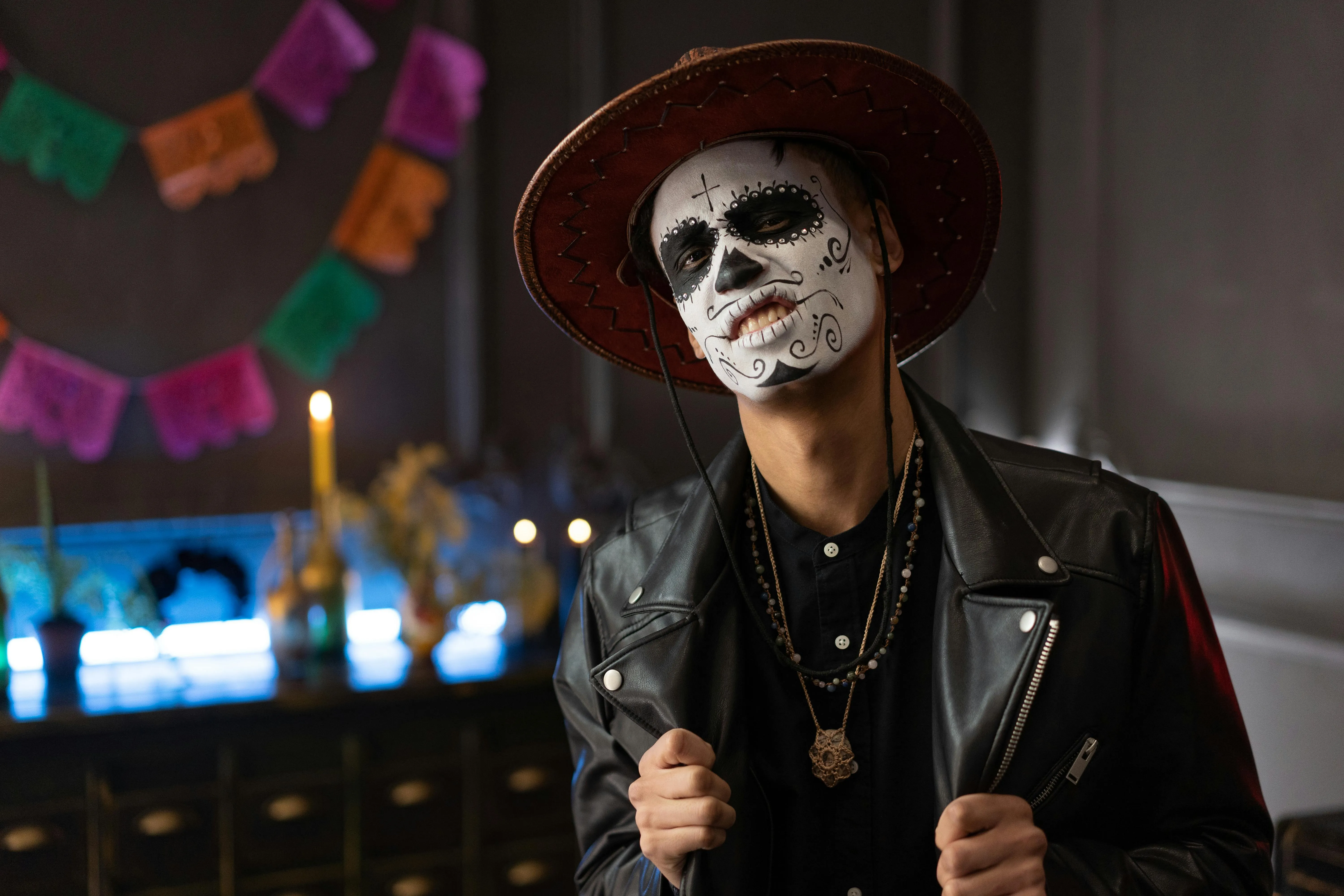 Man with Skull Face Paint and Red Hat Halloween Look image
