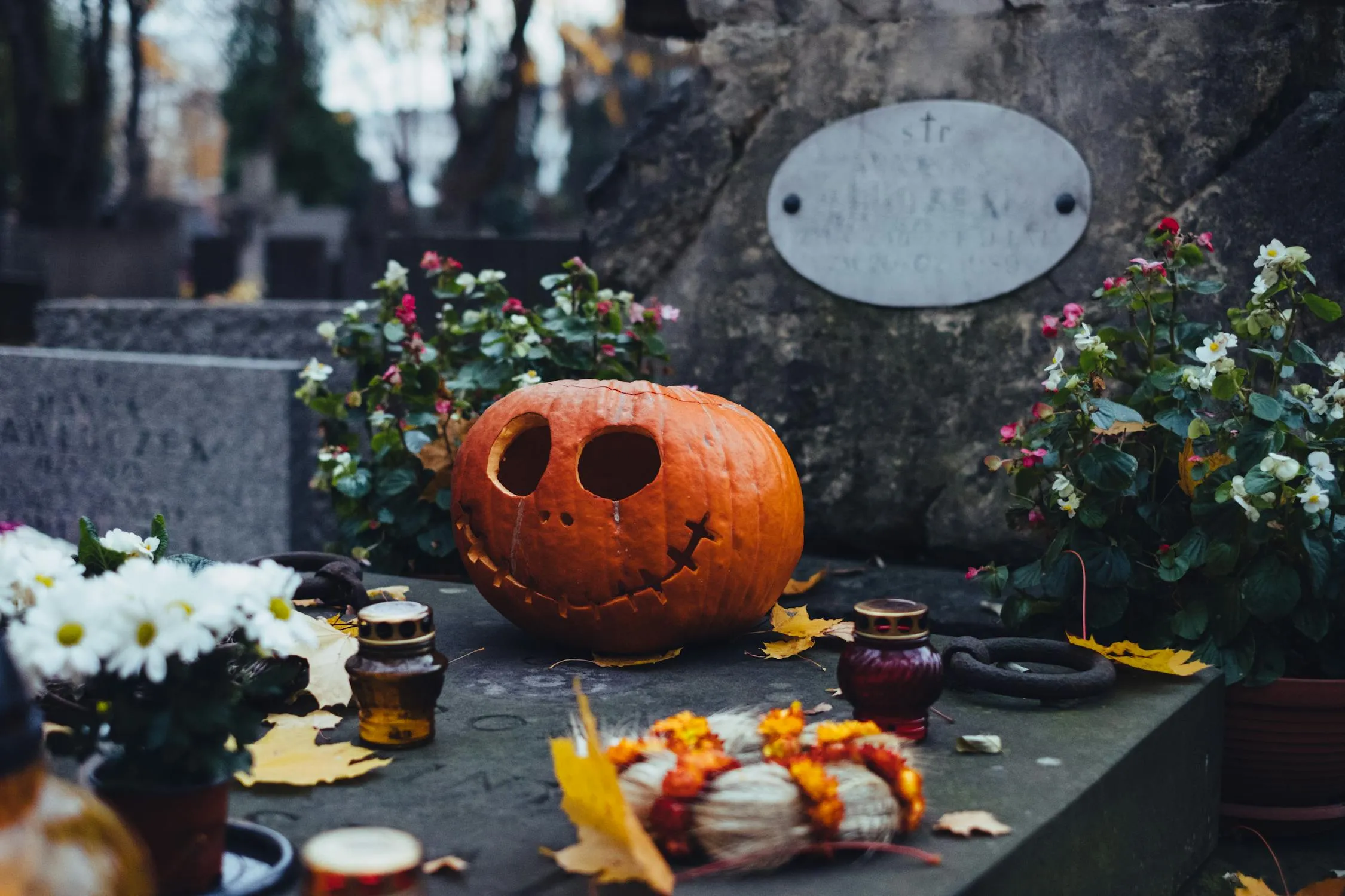 Memorial Altar with Carved Pumpkin and White Flowers