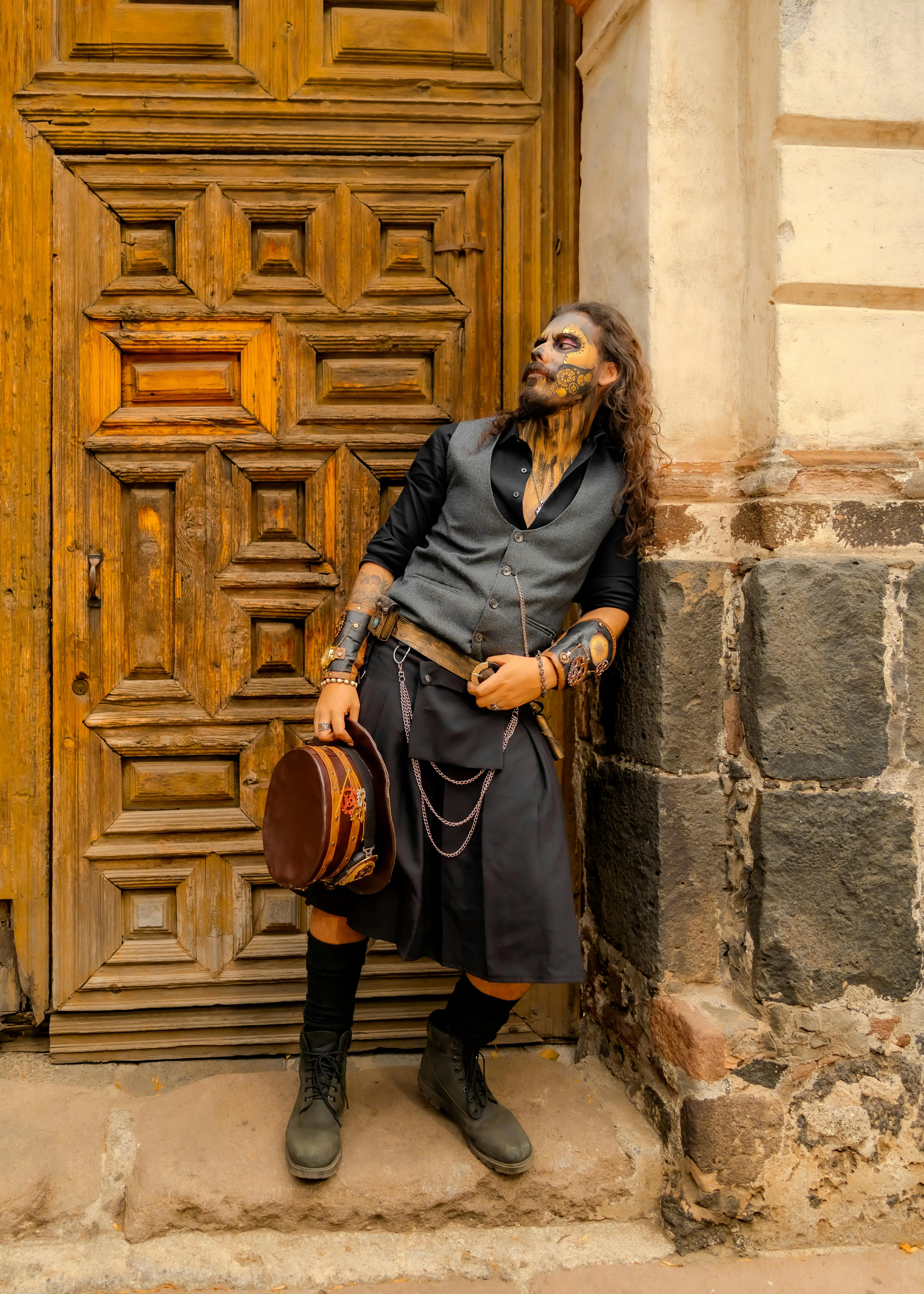 Men in Costume Leaning Against Wooden Door Wallpaper