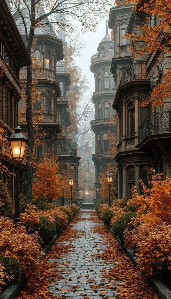 Narrow Cobblestone Street with Fall Foliage and Pumpkins