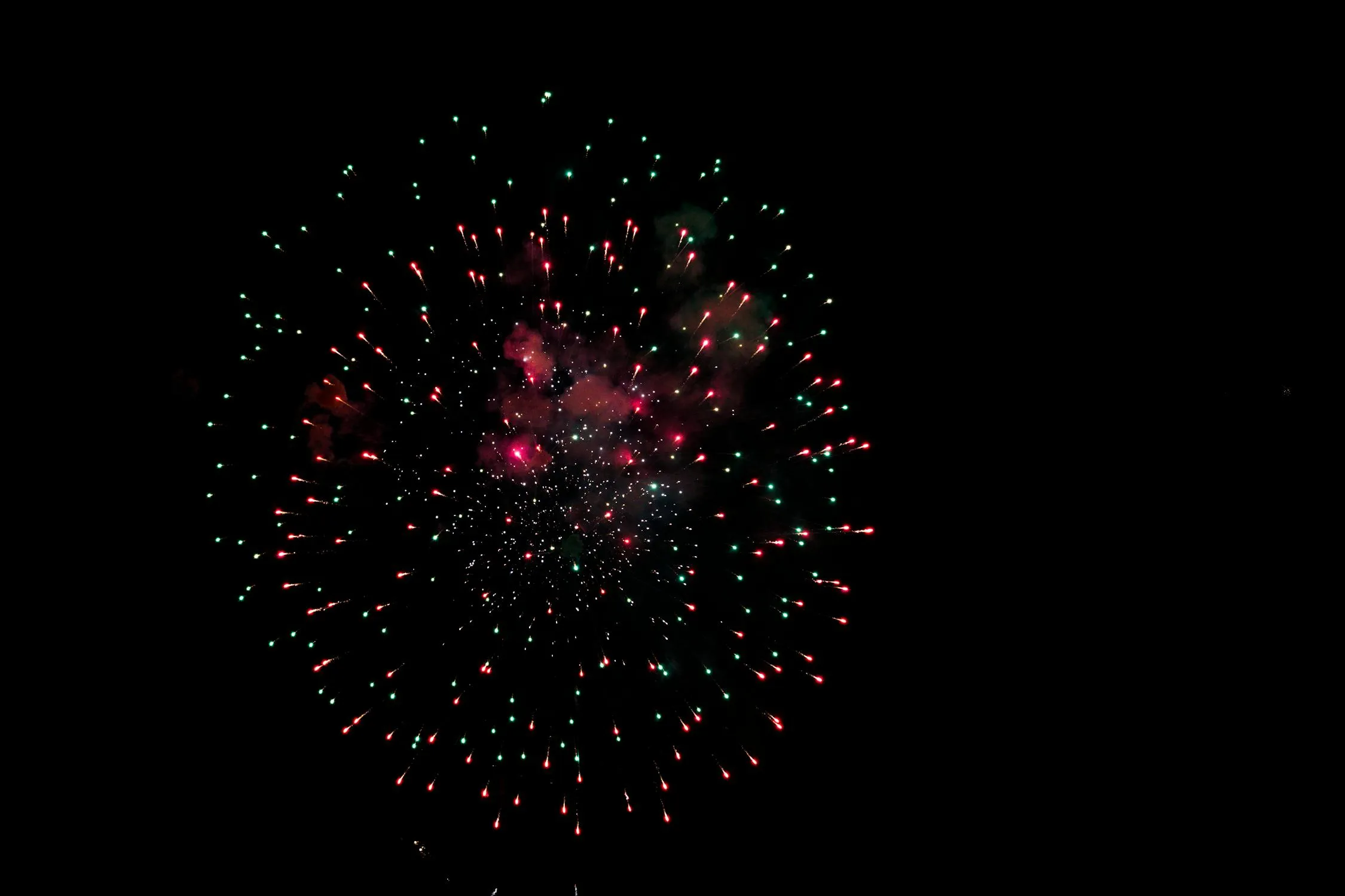 Night sky filled with bursts of colorful fireworks image