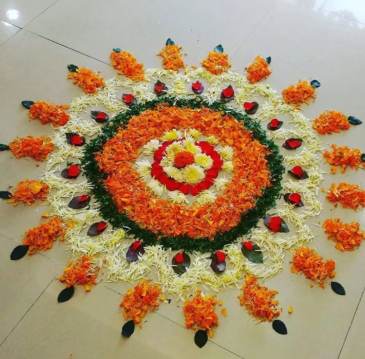 Onam Athapookolam with marigold flowers and leaf details