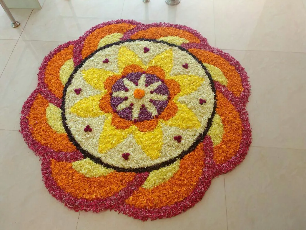 Onam celebration colourful floral rangoli design images