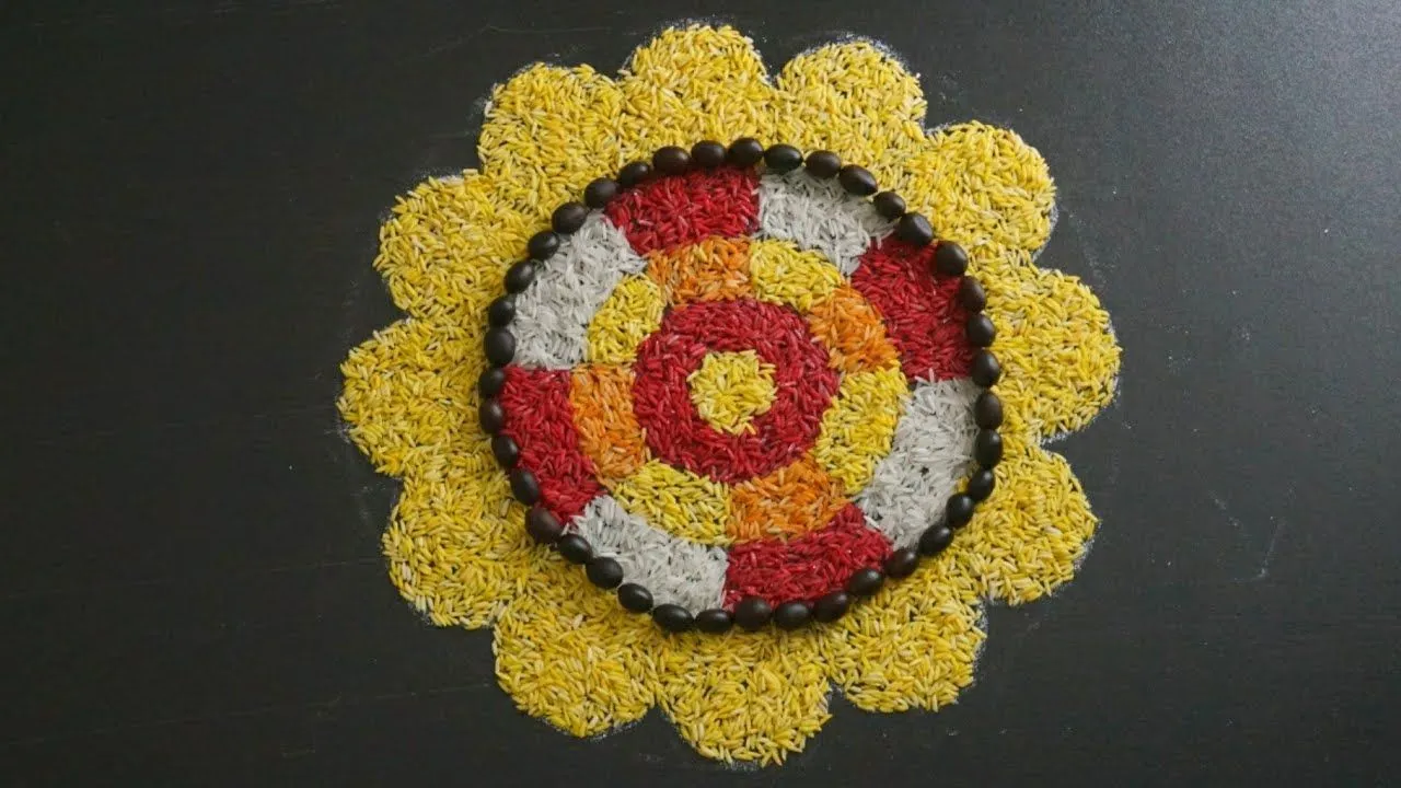 Onam Pookalam using coloured rice and coffee Beans
