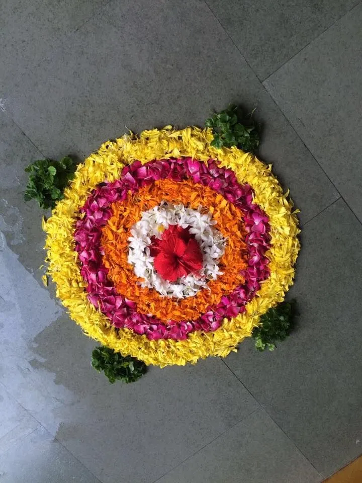 Onam pookolam with Hibiscus and layered petal design image