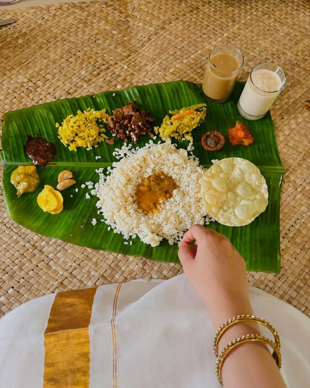 Onam sadya with One girl eating the onam sadya poster