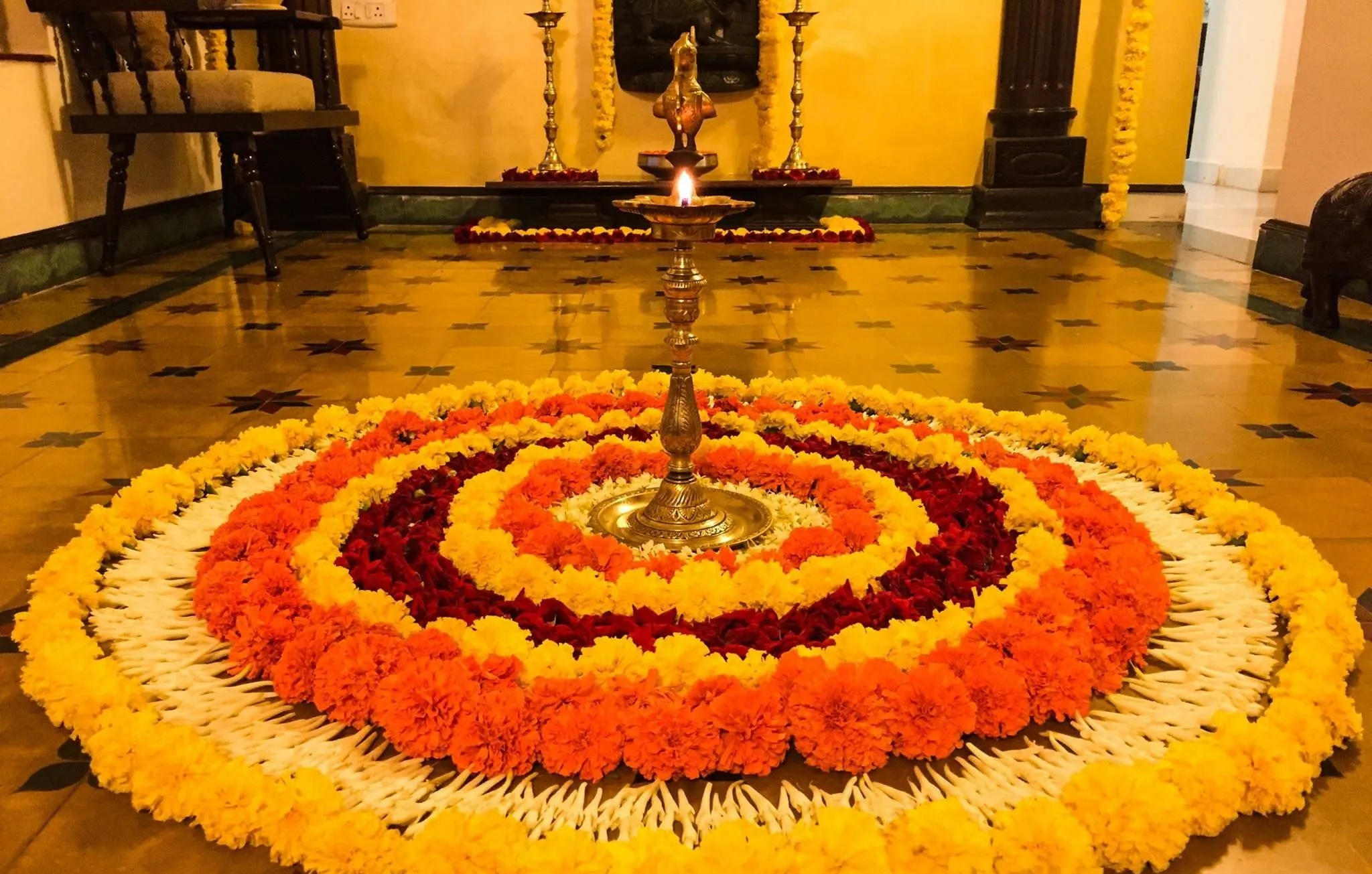 Onam special Athapookolam and lamp design in center