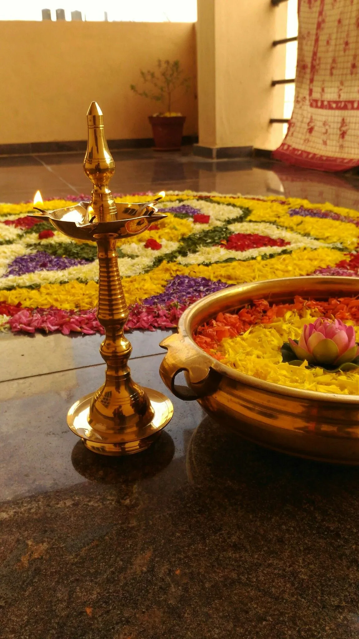 Onam special with Athapookolam design and lamp design