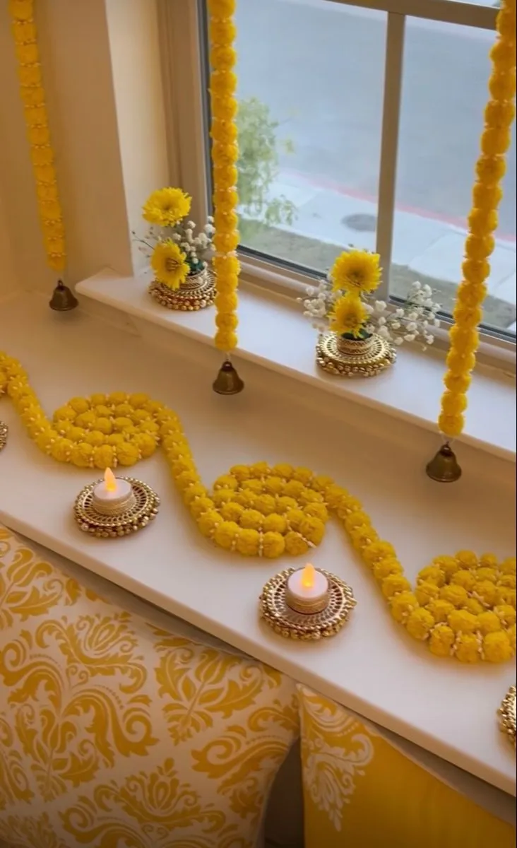 Onam window flower decoration ideas with oil lamps image
