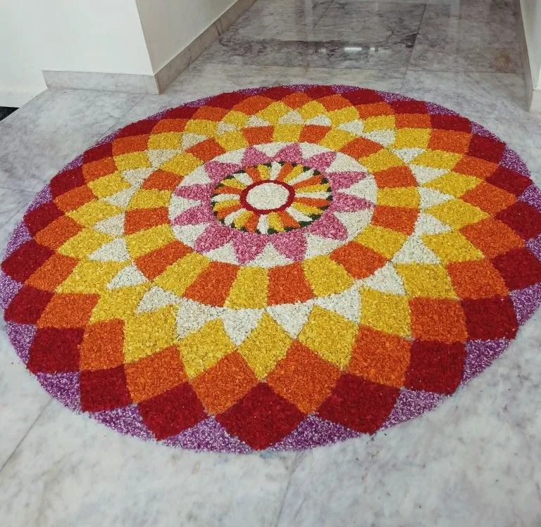Orange and yellow Alternative floral circular pookolam