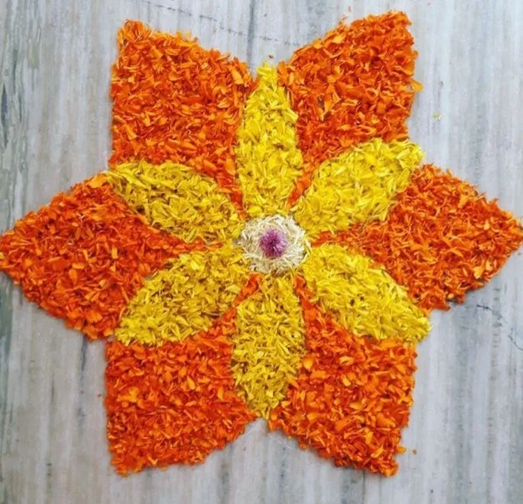 Orange and yellow floral design with purple flower center