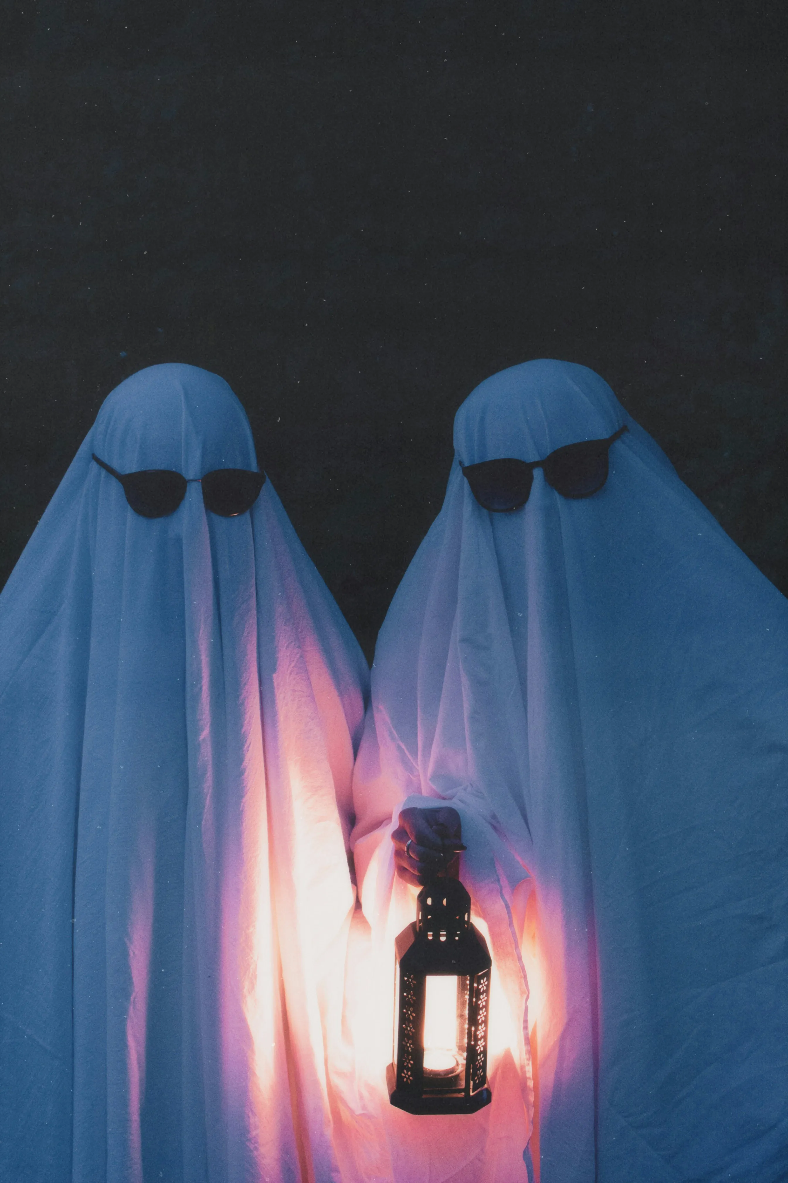 Pair of Ghost Costumes Holding Lantern at Festival Wallpaper