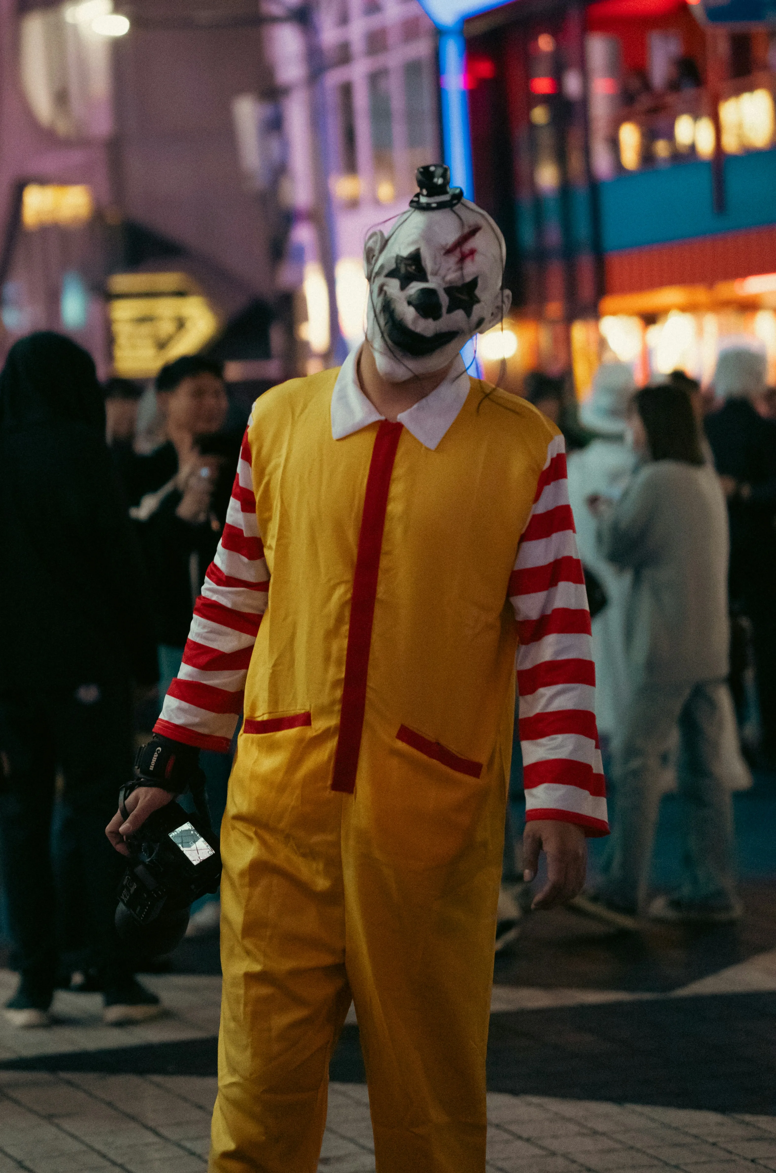 Person in Clown Costume at Halloween Festival Wallpaper