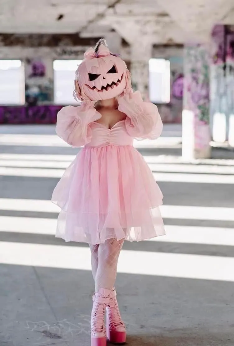 Person in Pumpkin Head Costume with Smoke for Halloween