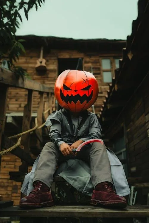 Person with Pumpkin Head sitting in stairs Wallpaper