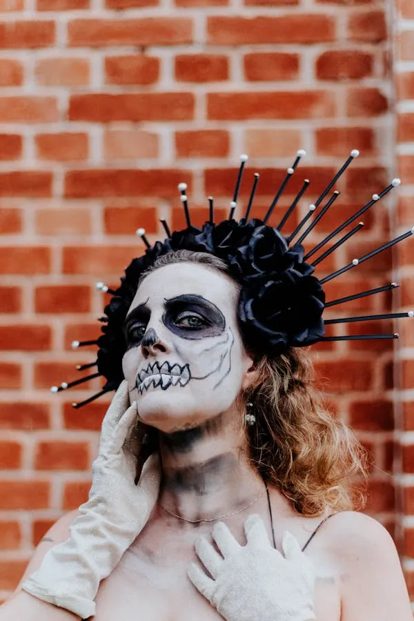 Person with Skull Makeup at Halloween Festival Wallpaper