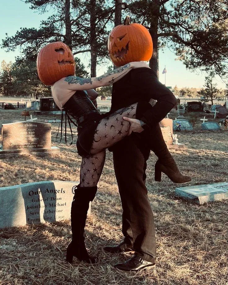 Playful Couple Halloween Festival with Pumpkin Masks