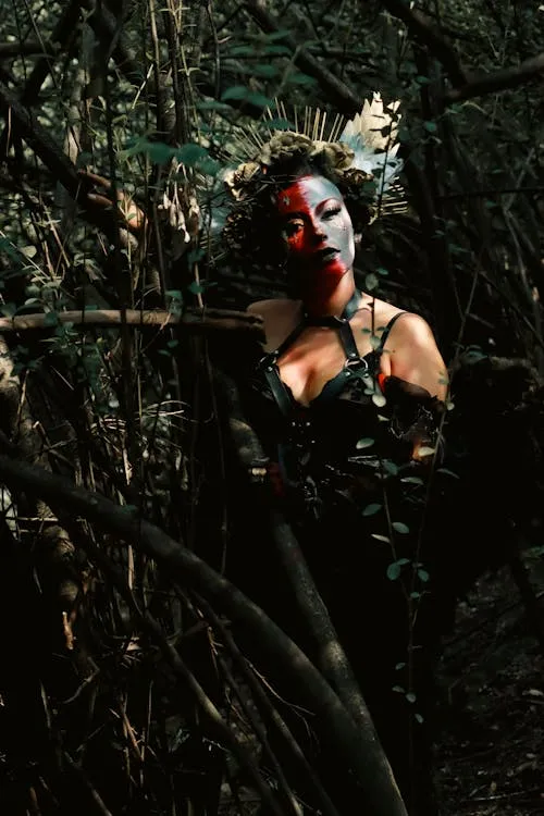 Portrait of Woman with Tribal Face Paint in a Forest Setting
