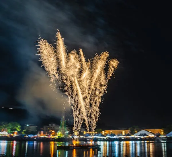 Powerful Golden Fireworks Rising above the Waterfront City