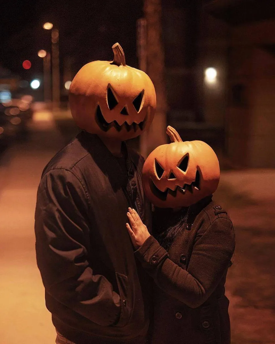Pumpkin Couple Embracing in Halloween Evening Atmosphere