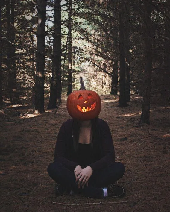 Pumpkin Head Character in a Mysterious Halloween Forest