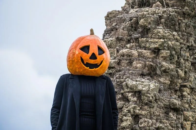 Pumpkin Head Costume in a Scenic Halloween Outdoor Setting