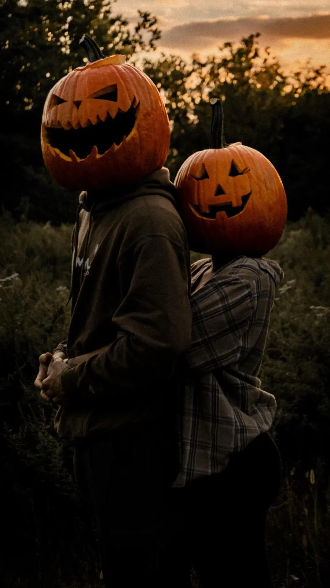 Pumpkin Head Couple Enjoying a Spooky Evening Walk image