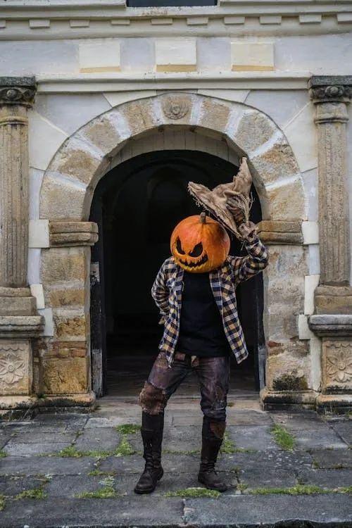 Pumpkin Head in Dark Outfits taking Halloween Photoshoot