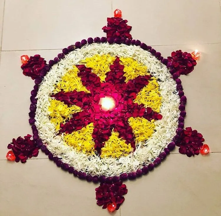 Purple circular border pookolam with glowing light corners