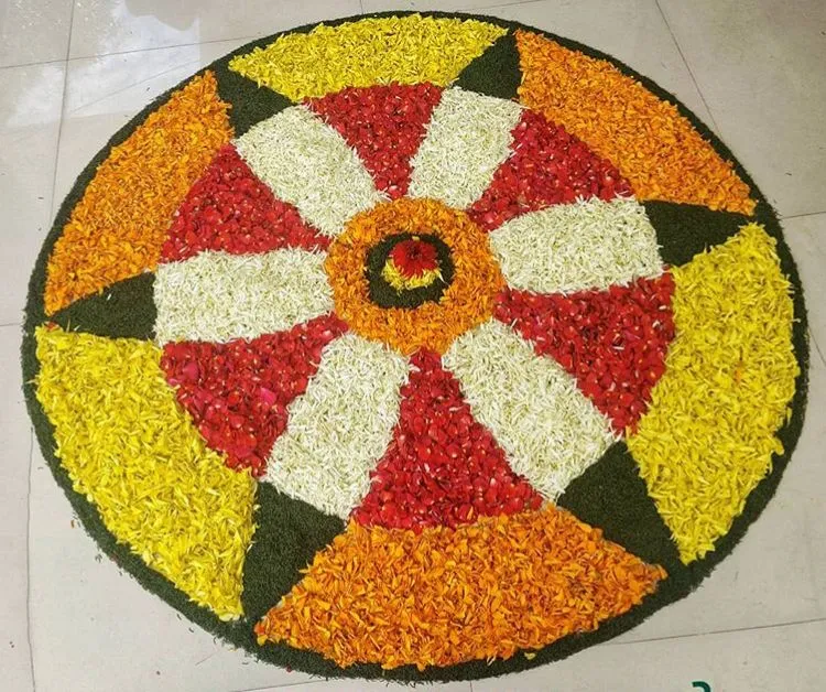 Radiant Onam pookalam with bold red and yellow Design image