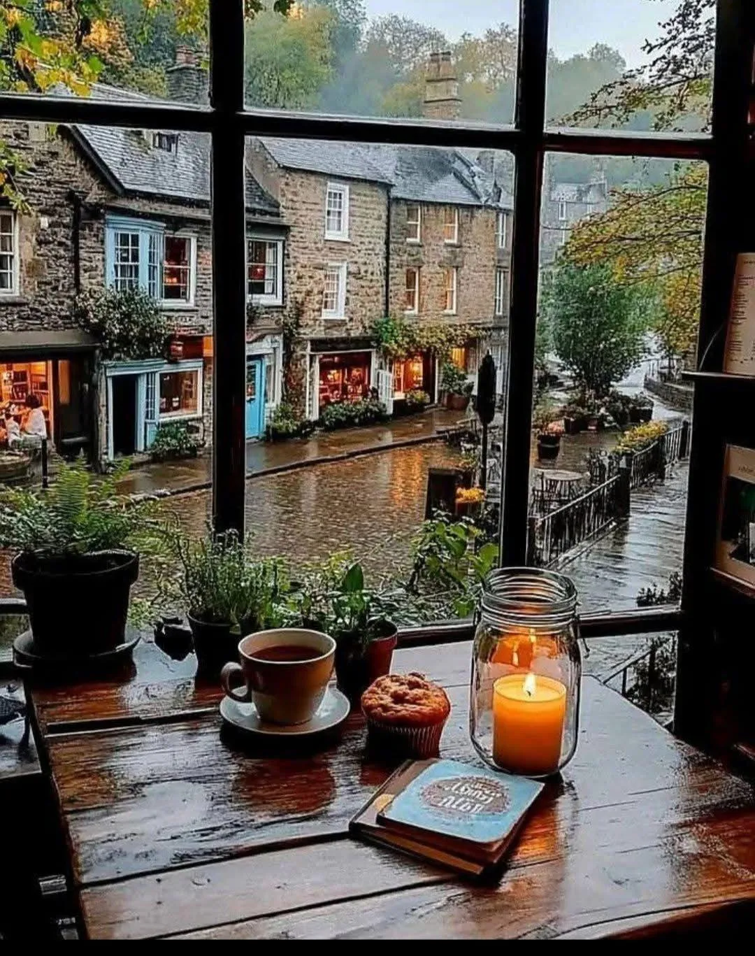 Rainy Day Window View with Pumpkin Decor and Warm Candlelight