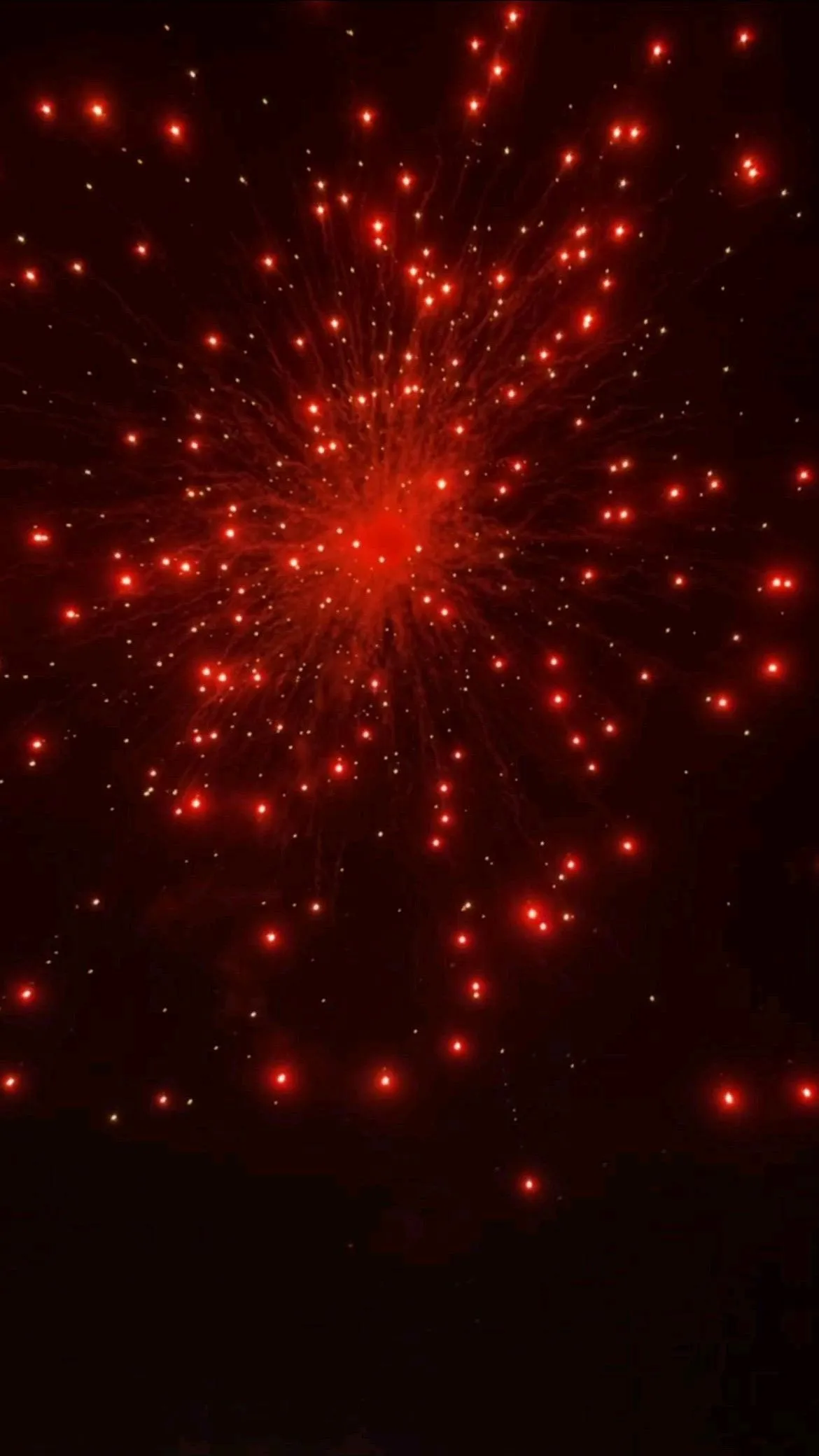 Red and gold fireworks creating a magical night display