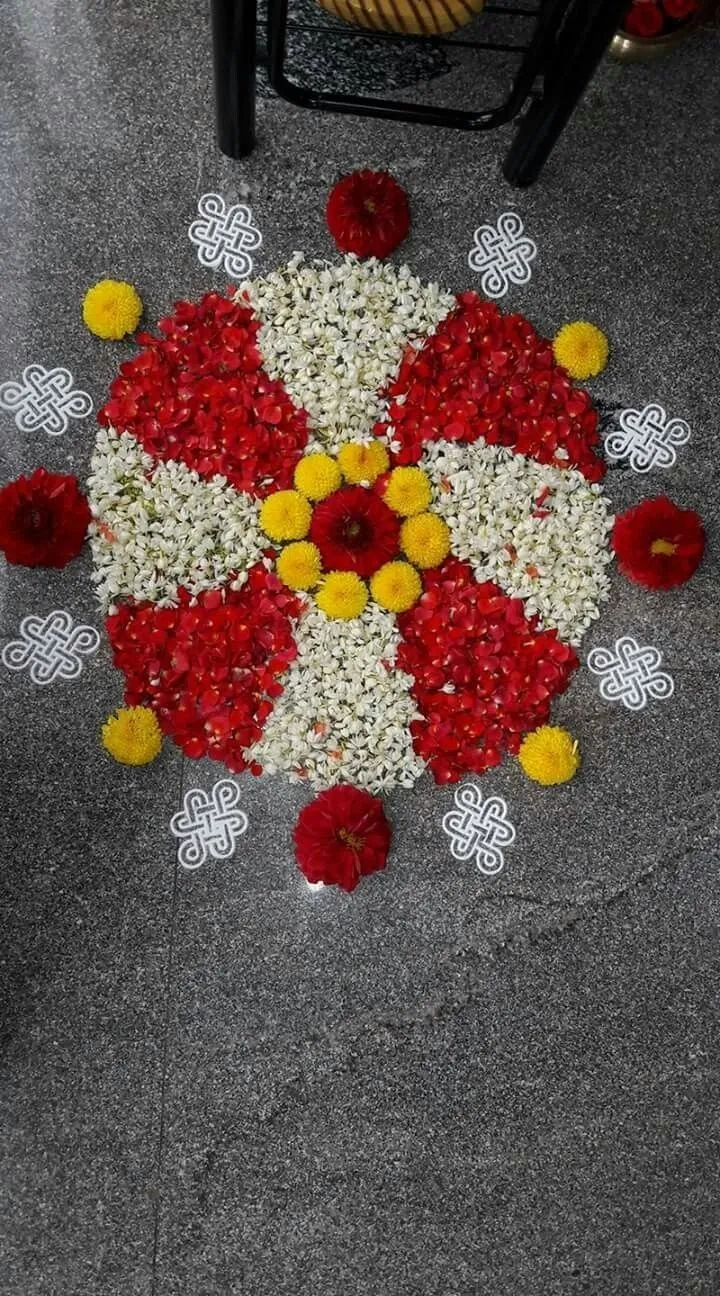 Red and white round pookolam with powder art free wallpaper