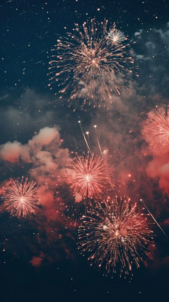 Red Fireworks Bursting Brightly In A Star Filled Sky