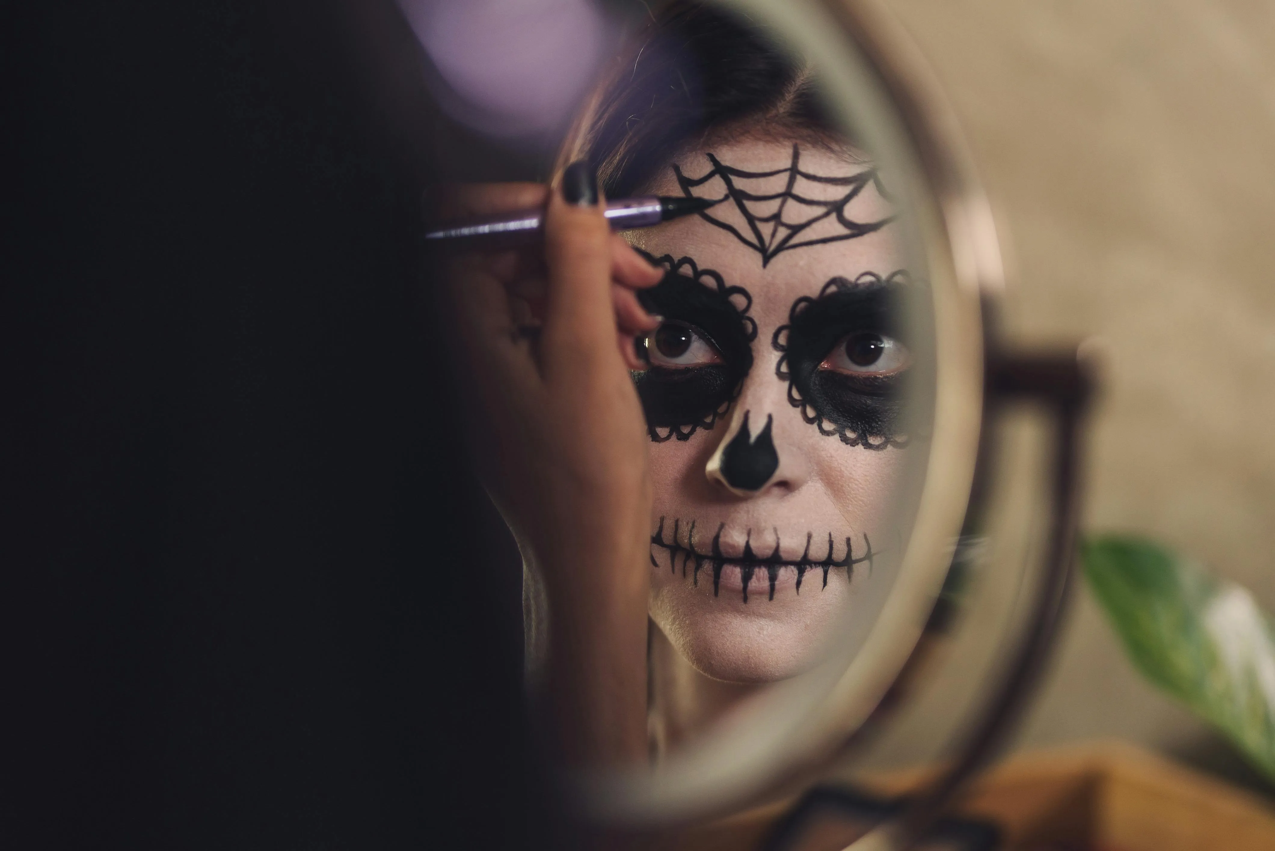 Reflection of Sugar Skull Makeup in Mirror During Halloween