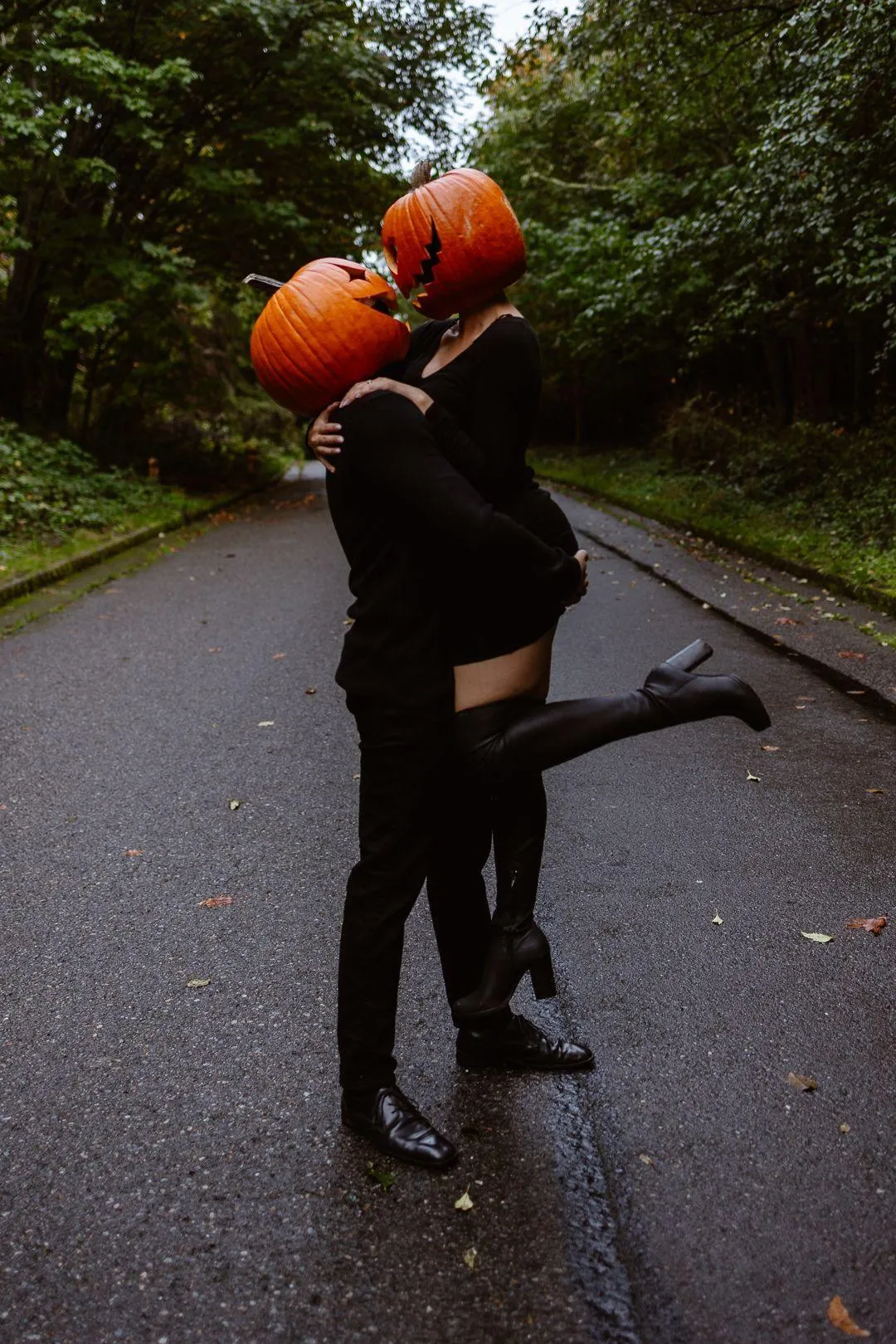 Romantic Hug Between Pumpkin Head Couple on Road image