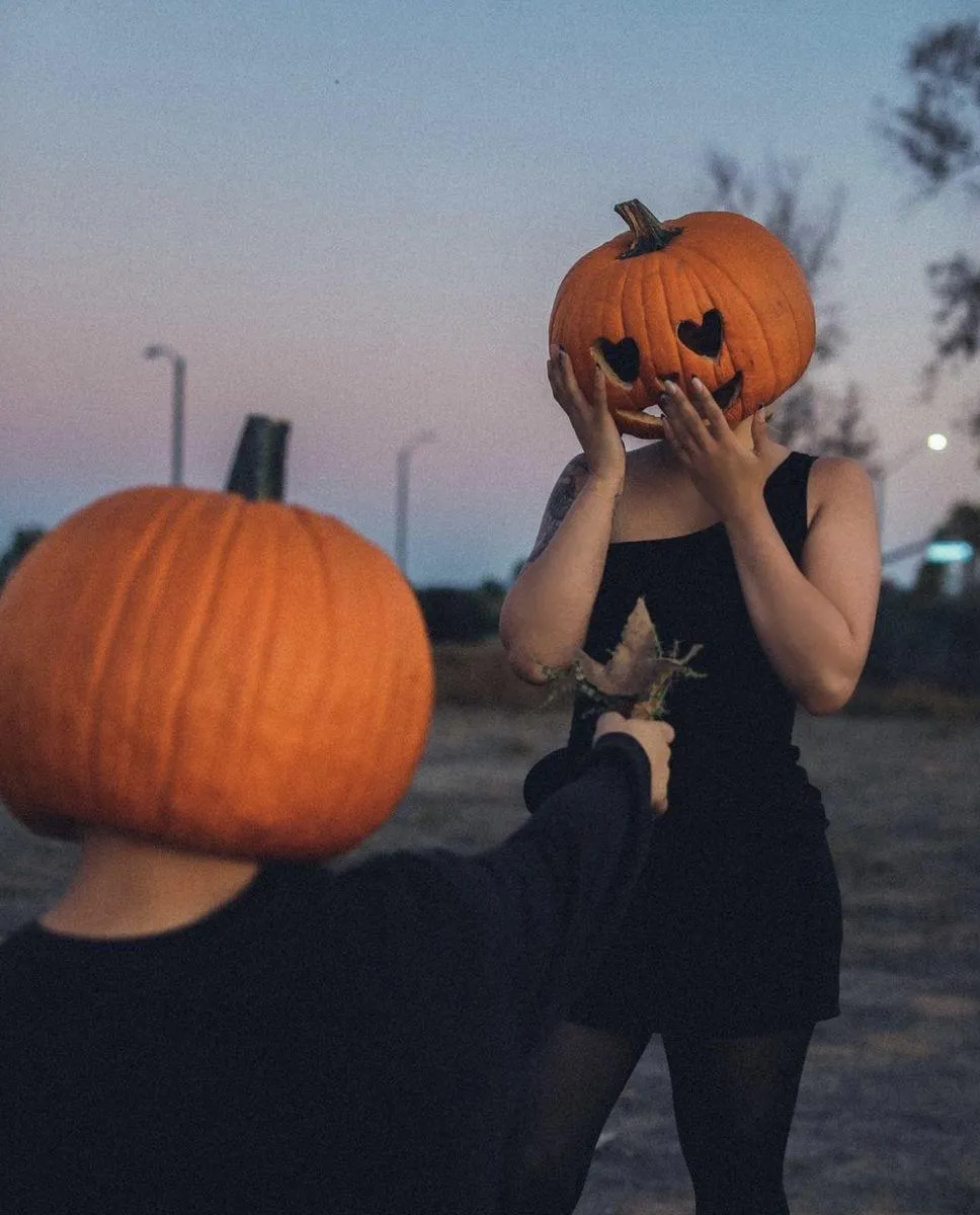 Romantic Pumpkin Head Couple Sharing Cute Halloween Moment