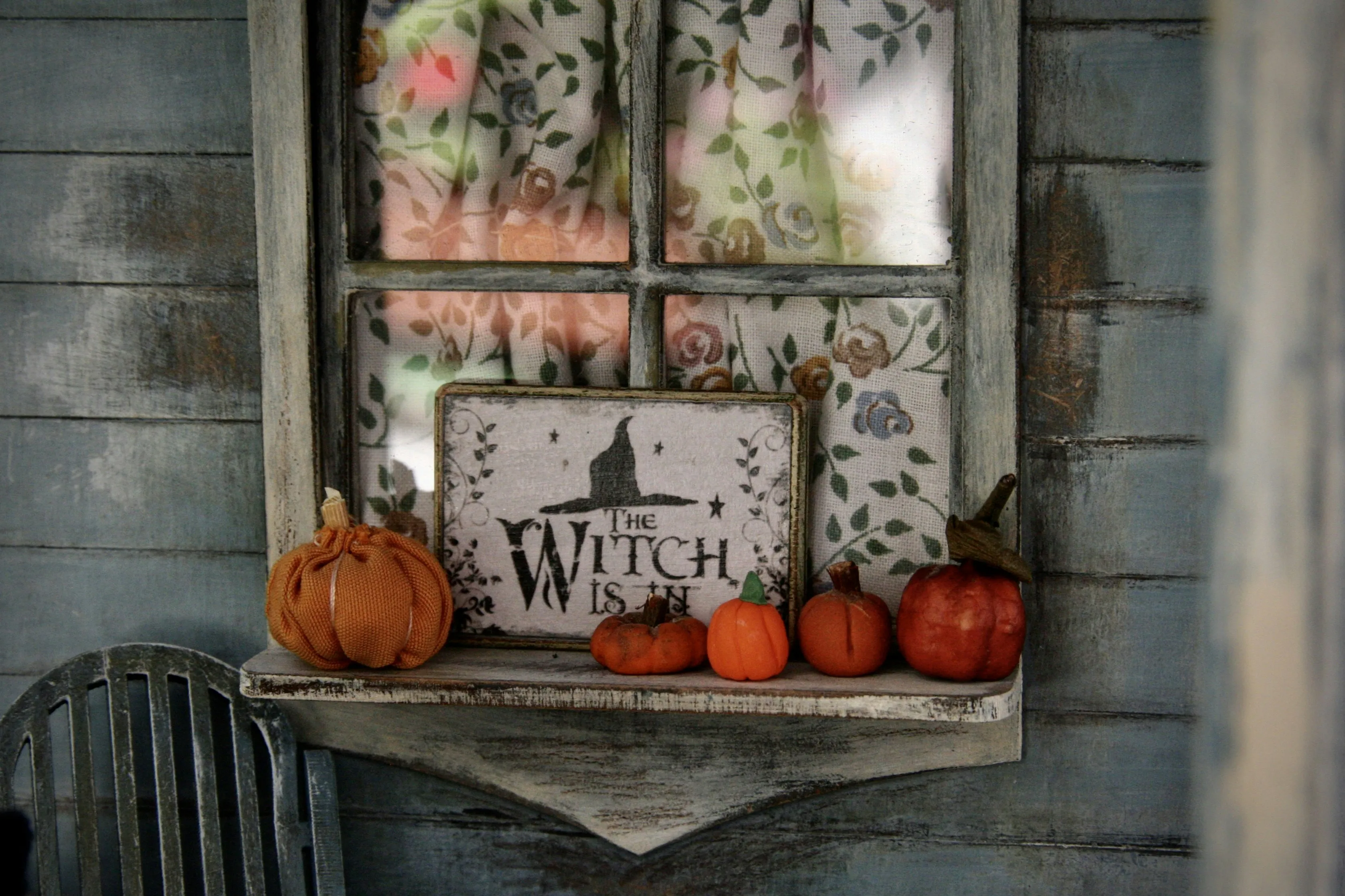 Rustic Window Display with Pumpkins and Witch Sign Wallpaper