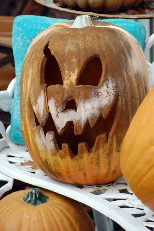 Scary Brown Carved Pumpkin with Sharp Teeth Wallpaper