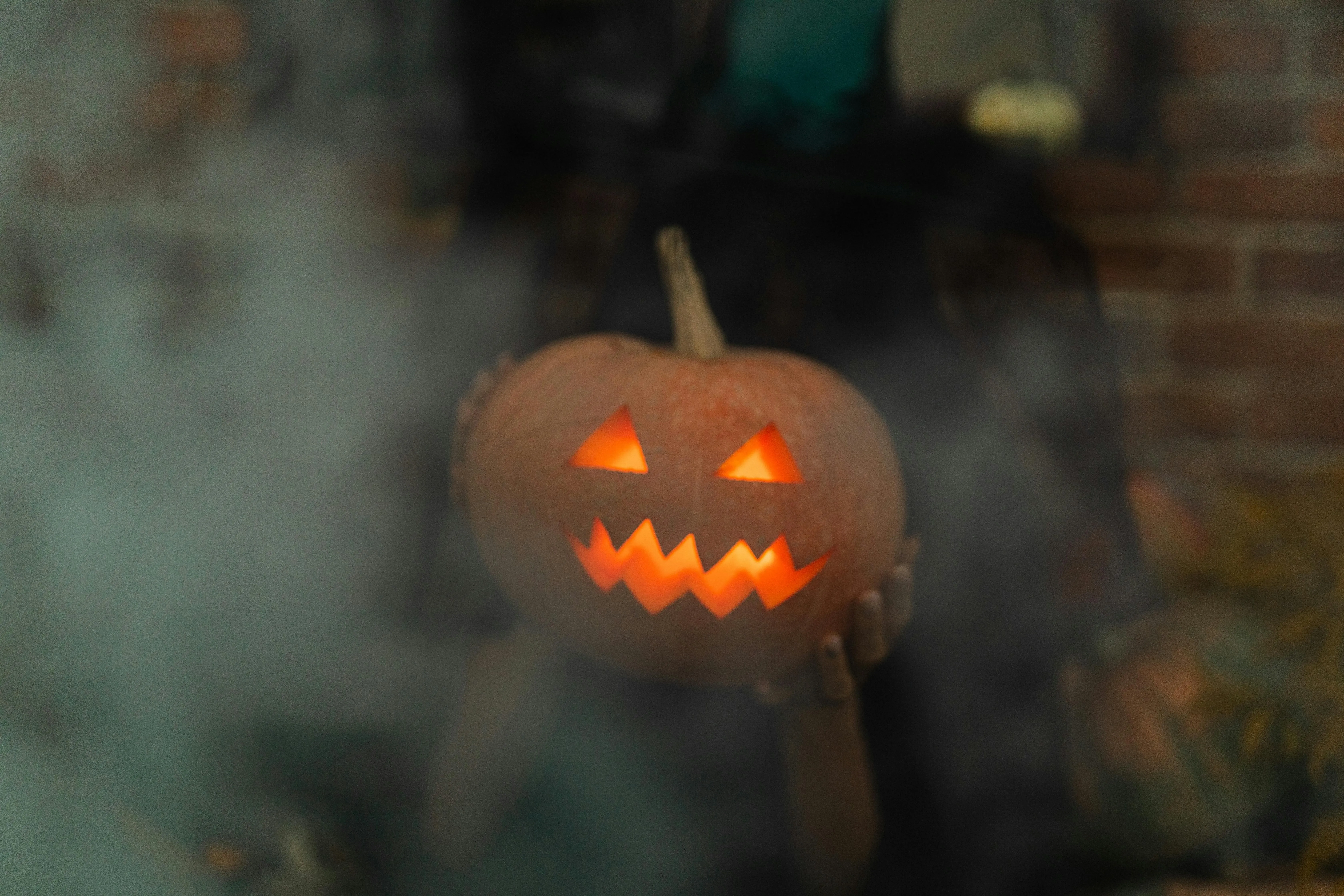 Scary Carved Pumpkin with Glowing Eyes and Smoke Effect