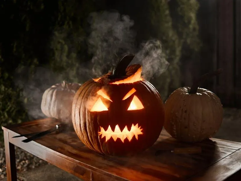 Scary Jack O Lantern on Wooden Table with Smoke Wallpaper
