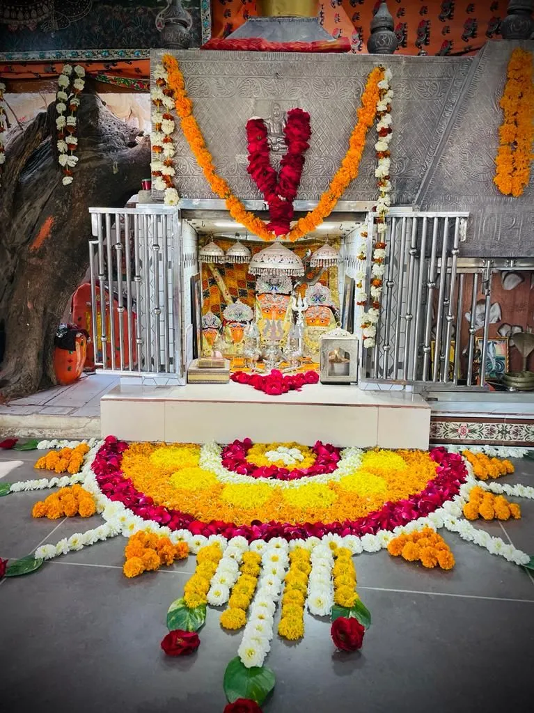 Semi circle floral pookolam design on a Temple entrance