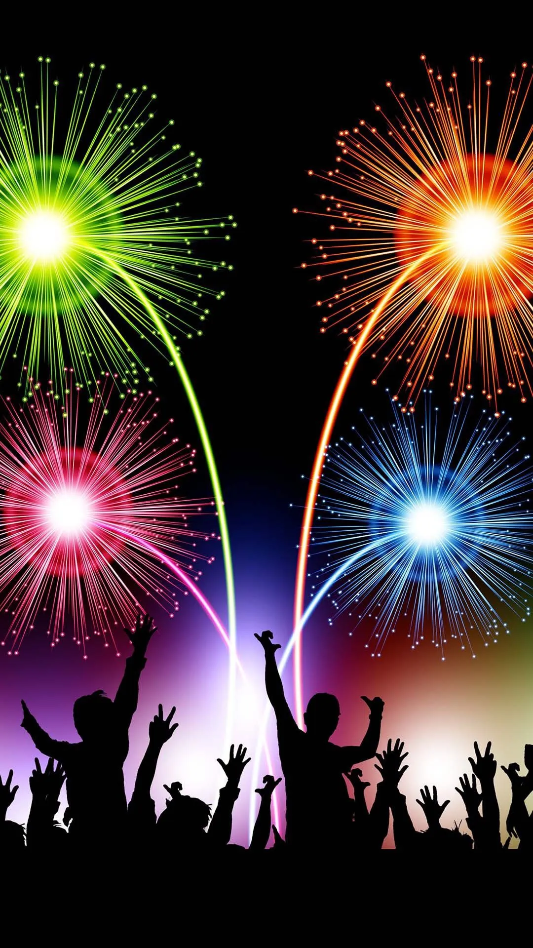 Silhouettes of people enjoying colorful fireworks at night